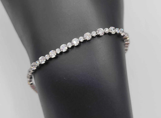 ELLE Sterling Silver Cubic Zirconia Tennis Bracelet with Ruby Accent